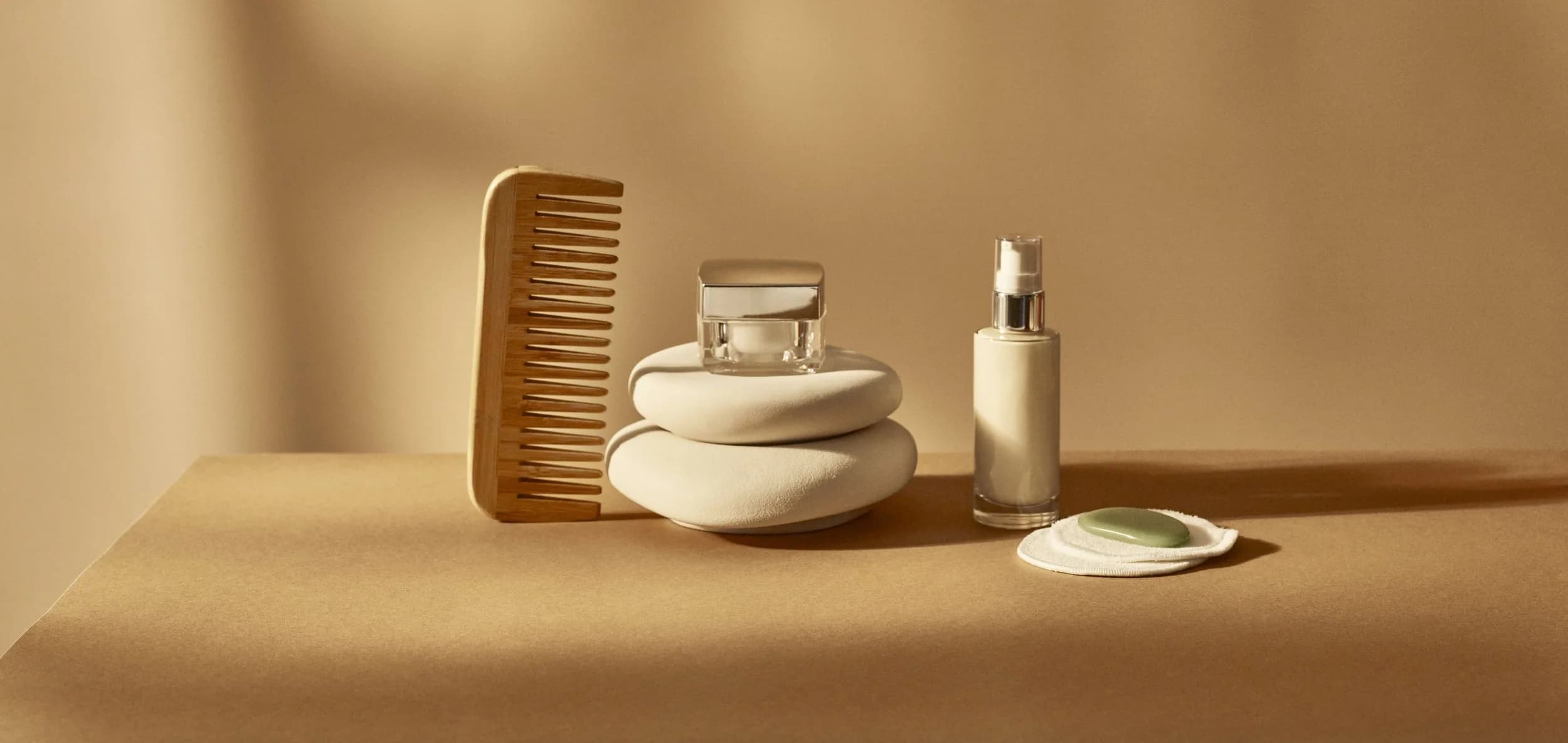 TINU Skincare products on warm surface