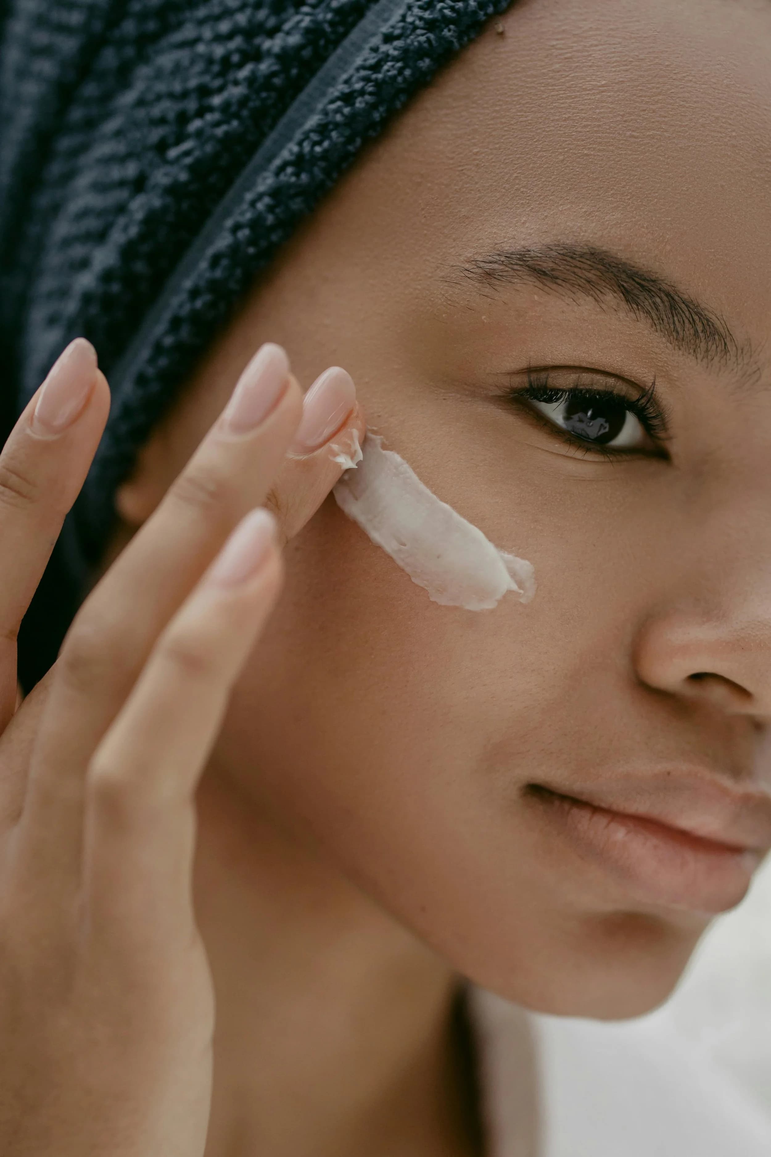 Woman applying skincare