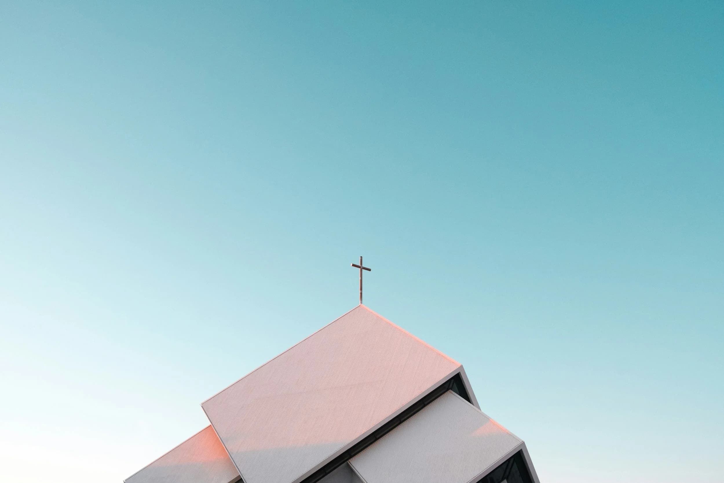 Church with distinctive architecture against blue sky
